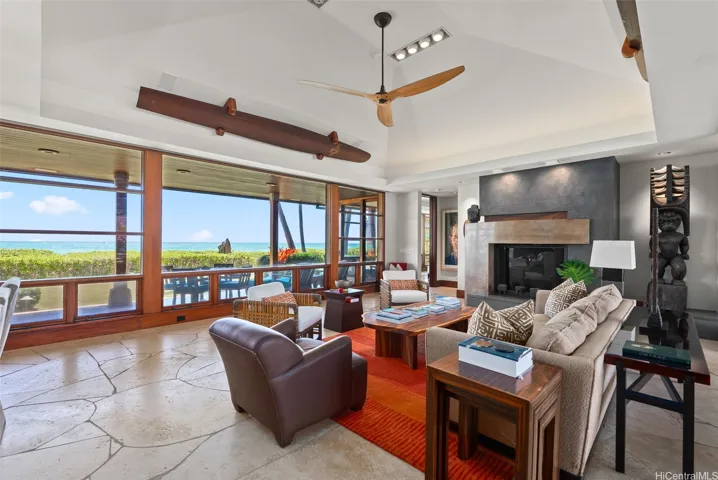 An artistic gas fireplace anchors the seating area for entertaining.