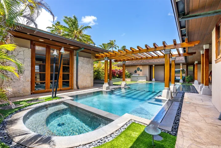 The spa is located just off the primary bedroom and workout room.