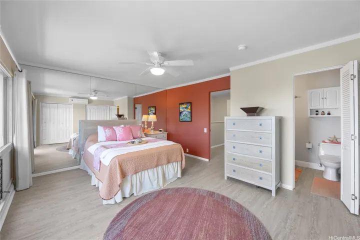 A spacious primary bedroom with en suite bath