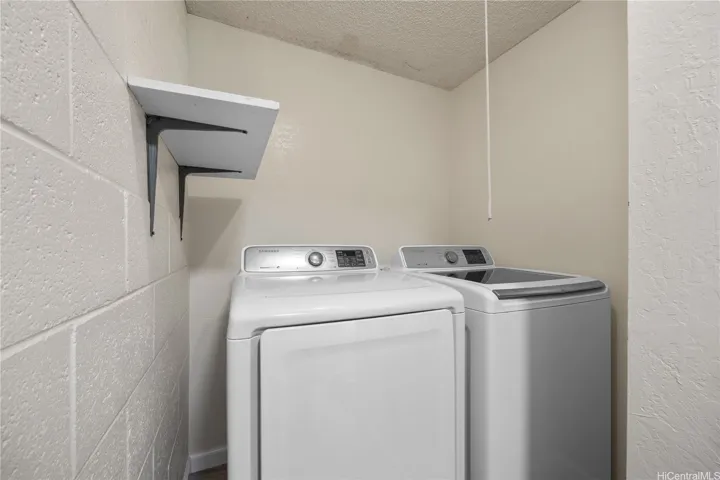 Laundry room with side-by-side washer and dryer