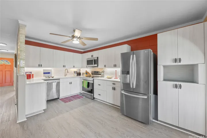 Open kitchen design with ample counter top space and good storage