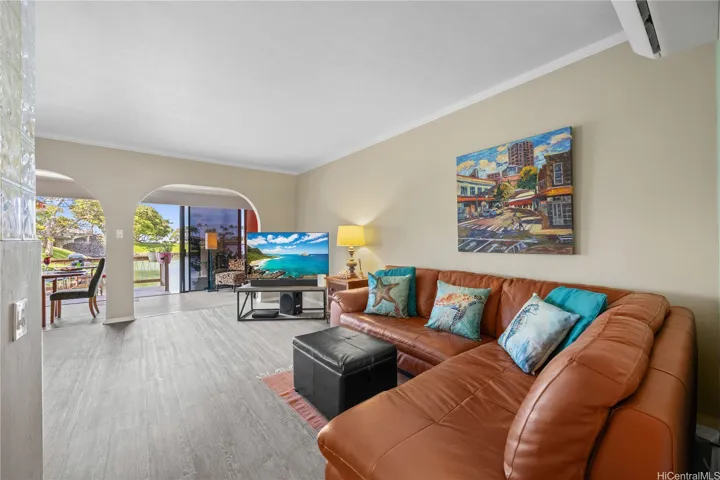 Your living room flows out toward your waterfront lanai