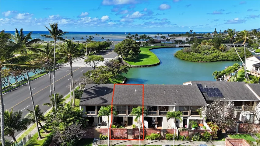 Aerial view of marina front residence 63 at the Moorings with the ocean close by
