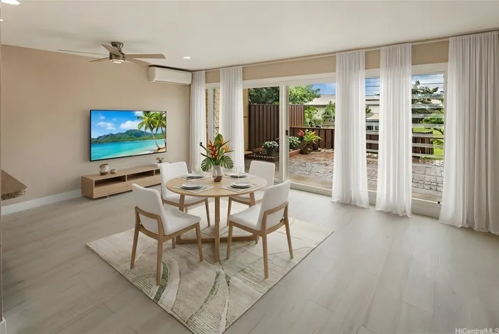 Dining area with lanai view. Virtually staged. Enhanced photo.