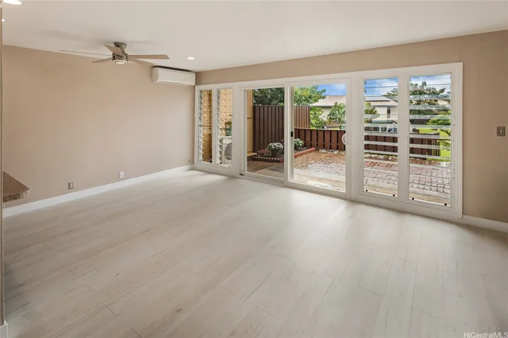 Unstaged dining room. Open floor plan. Enhanced photo.