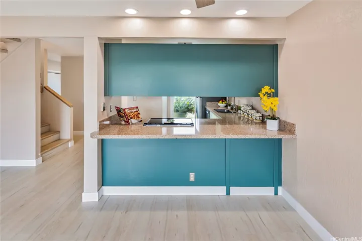 The kitchen view from the dining area. Enhanced photo.