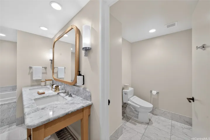 Primary Bathroom with private water closet, Toto washlet, soaking tub, and walk-in shower.