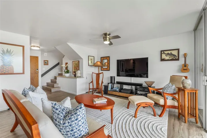 A spacious living area accommodates several pieces of furnishings comfortably.