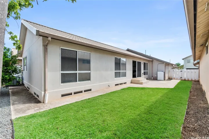 Low-maintenance side yard and exterior spaces, providing extra privacy and ease of care.