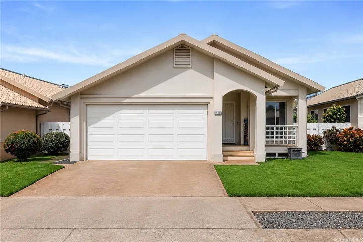Well-maintained exterior featuring a 2-car garage, 2-car carport, and additional street parking.