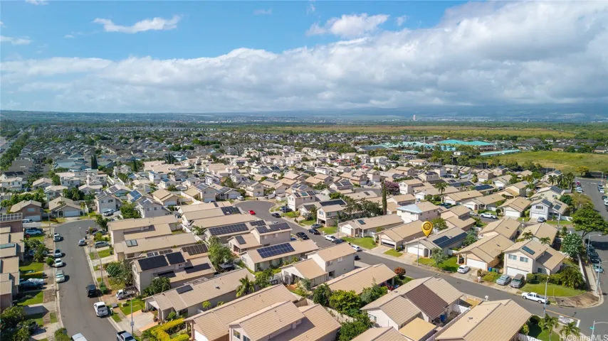 Breathtaking aerial view showcasing the beautiful Ewa Beach landscape and the home's prime location.