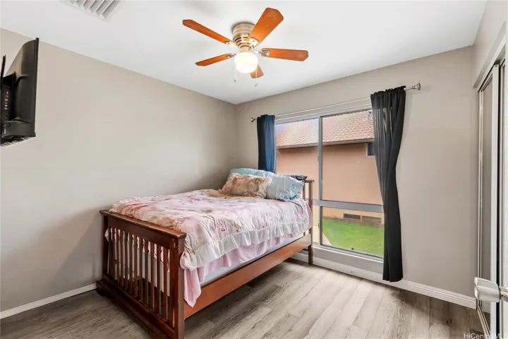 Comfortable and versatile secondary bedroom, perfect for family, guests, or a dedicated home office.