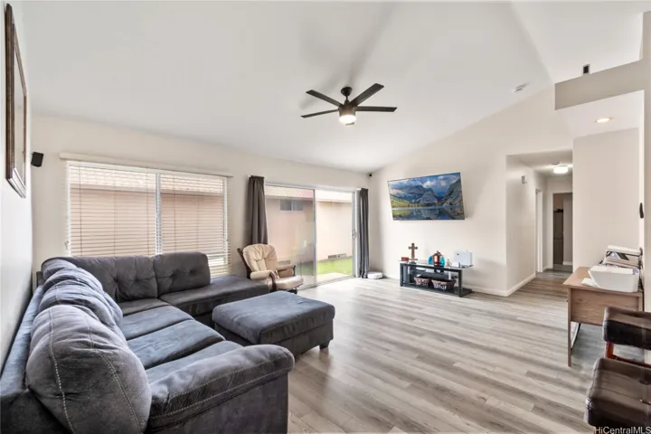 Spacious and inviting living area, perfect for relaxation and entertaining. Note the modern, upgraded flooring throughout.