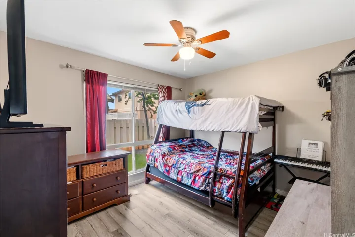 Bright and welcoming third bedroom, offering plenty of space, natural light, and flexibility.