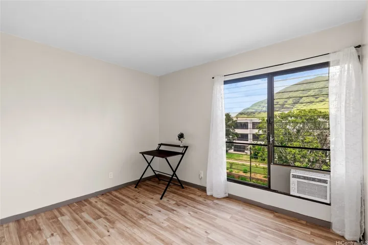 Second bedroom offers flexibility for guests, work, or everyday living.