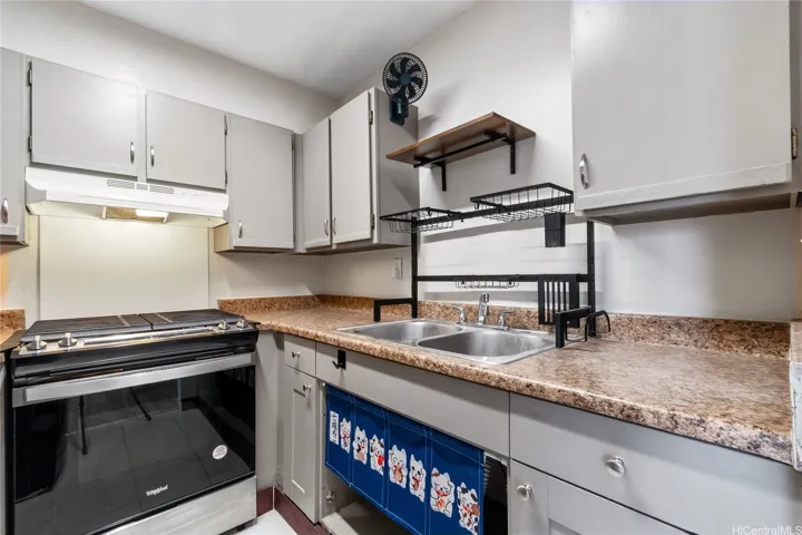 Refreshed kitchen with brand-new range and refrigerator.