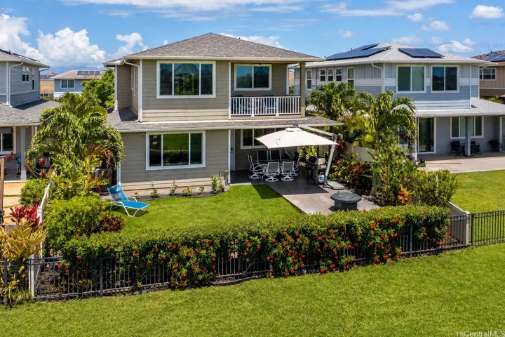 Golf course frontage in Kapolei: this Keali'i by Gentry home backs directly to the 17th fairway of Kapolei Golf Course with a landscaped yard and no rear neighbors.