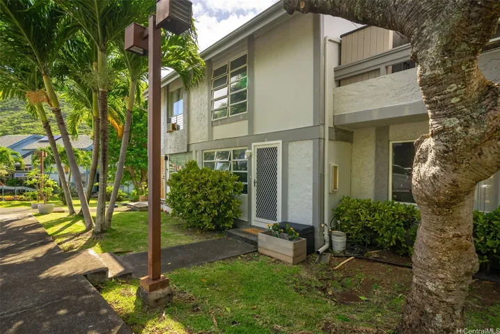 Front door on your right and walkway to the pool and storage area on your left