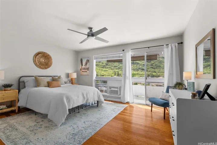 Spacious primary suite with a private lanai with stunning mountain views