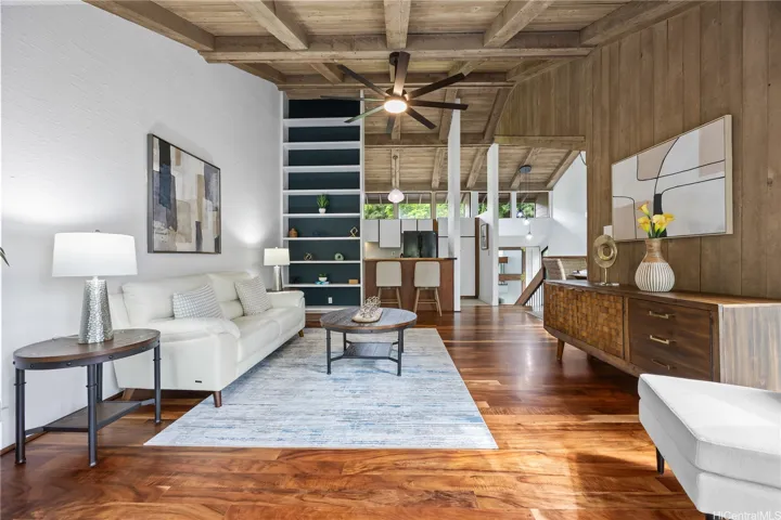 Vaulted ceilings and koa floors adorn your living room which flows to your covered lanais