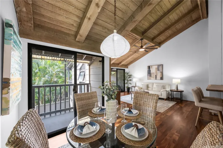 Vaulted ceilings and koa floors adorn your living room which flows to your covered lanais
