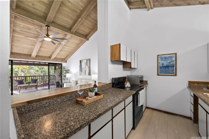 Your kitchen opens up to the living room with countertop seating and ample natural light
