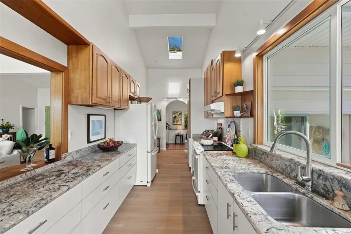 This kitchen was remodeled in 2007 and features granite countertops and ample storage space.