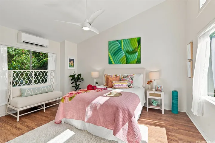 Spacious second bedroom featuring air conditioning and large windows with panoramic views of the bay.
