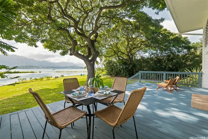 This spacious lanai is ideal for seamless indoor-outdoor living, offering breathtaking views of the bay and the Ko'olau Mountain range.