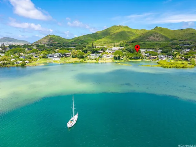 Aerial view showcasing the homes exceptional waterfront setting with the ever changing colors of Kaneohe Bay.