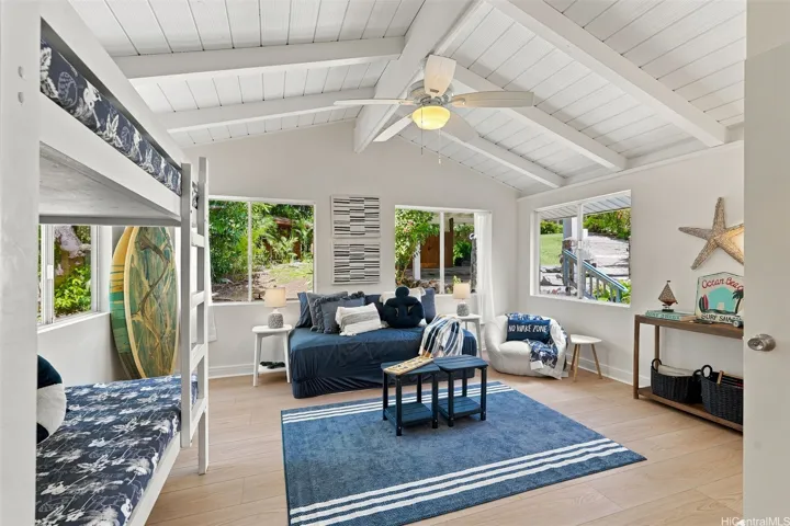 Oversized third bedroom featuring soaring ceilings, dual closets, and an abundance of natural light.