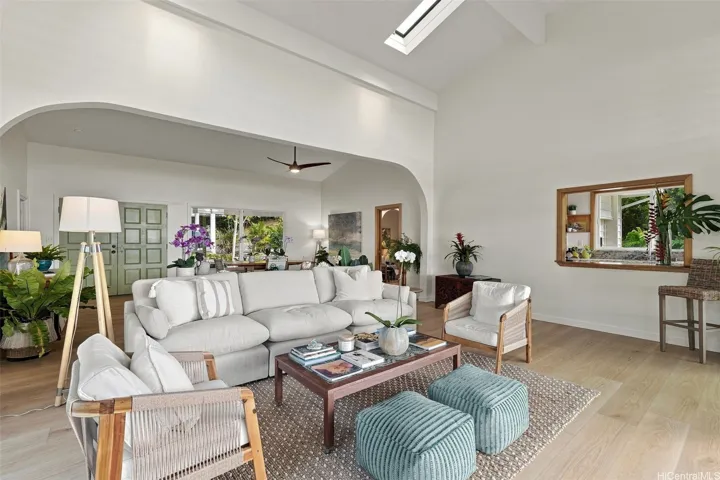 Featuring new flooring and a fresh coat of paint, this bright, airy space is enhanced by abundant natural light and soaring ceilings.