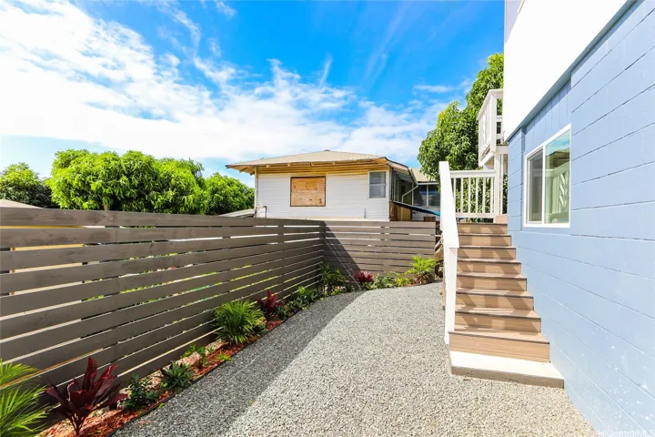 Stairs to back deck that leads to side entry