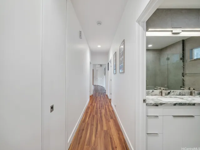 Hallway to laundry, 3 bedrooms and 2 bathrooms. Bright, Clean and all NEW.