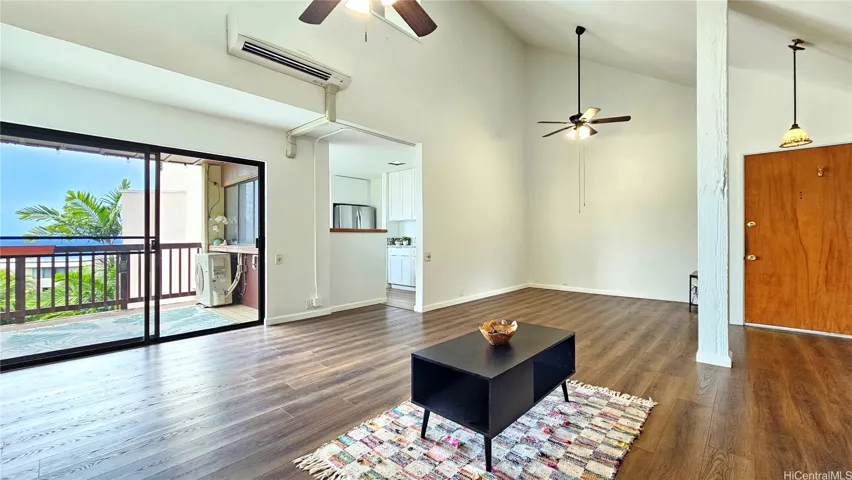 Spacious living/dining space with vaulted ceiling and lots of natural light. You have ocean and mountain views from here too!