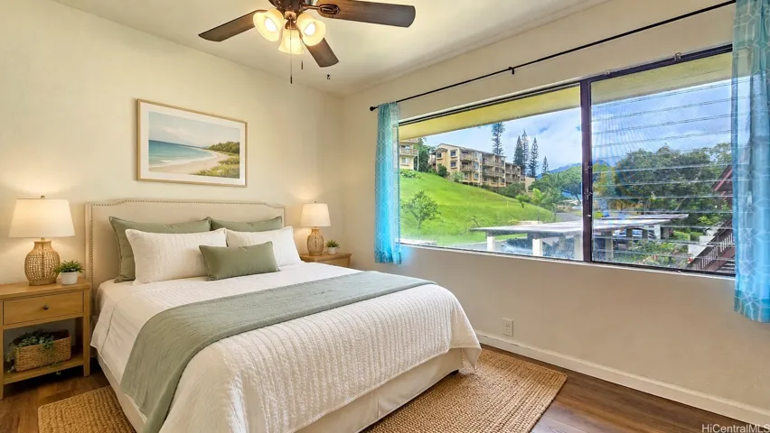 Downstairs bedroom. Virtually staged. Windows on both sides for more air flow.