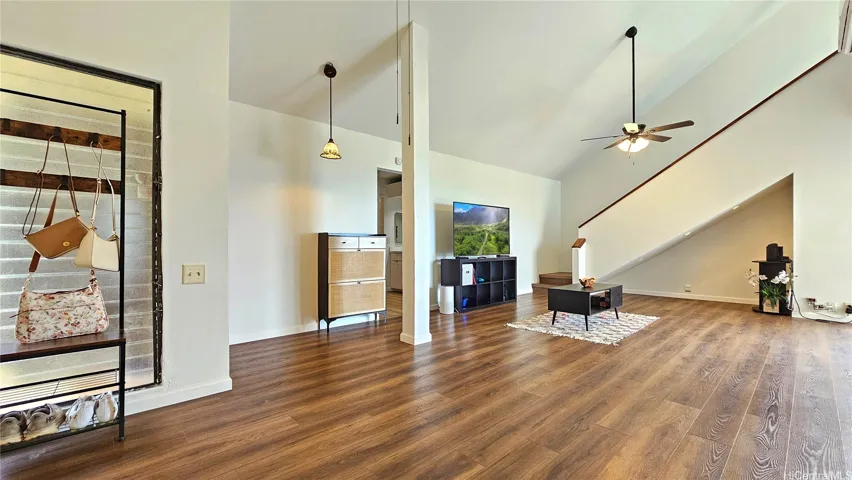 Another view of the living space facing the stairs towards the primary bedroom.