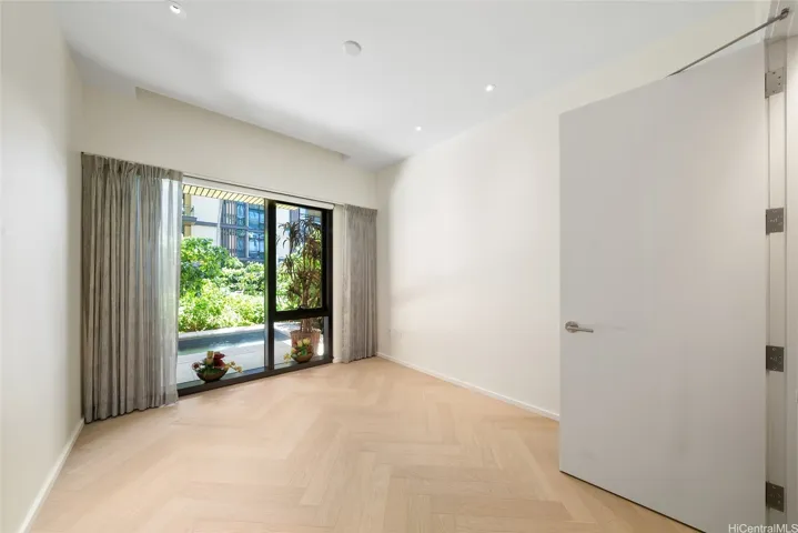 Secondary bedroom with custom walk-in California Closet