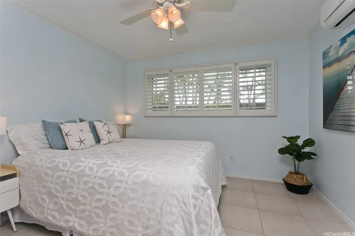 Downtairs bedroom with full bath . Shutters throughout the home .