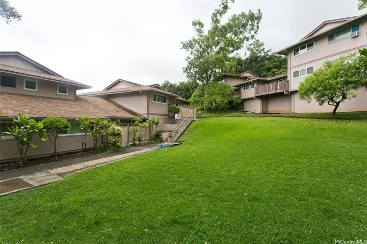 Lush landscaping and large grass area welcomes you as you enter your home. with 2 assigned parking .
