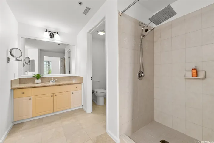 The bathroom in the main bedroom offers 2 separate sink countertop areas as well as a walk in shower.