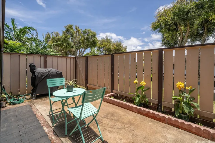 Fenced Yard next to open space.