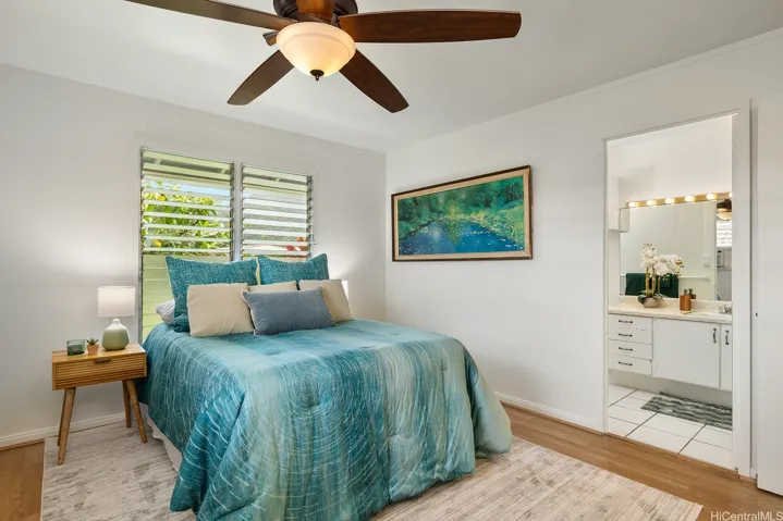 Primary en-suite bedroom, downstairs right by the Puakenikeni tree