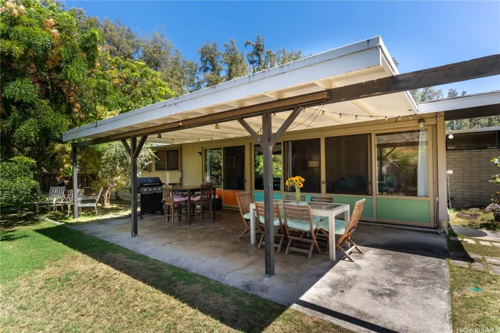 Covered lanai area is perfect for family gatherings and can be used as an additional dining area.