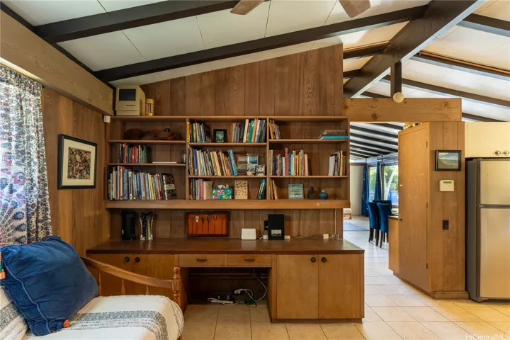 Built-in cabinets and desk showcase the mid-century design.