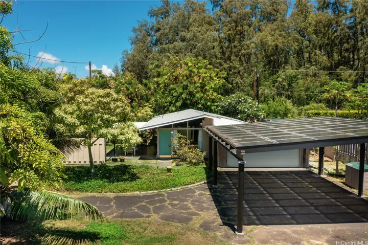 Home offers lots of outdoor space as well as 24 owned and net metered PV panels.