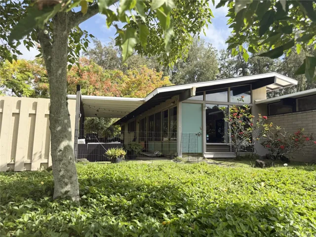 Mid Century design with covered lanai and large 14,518 sq. ft. lot.