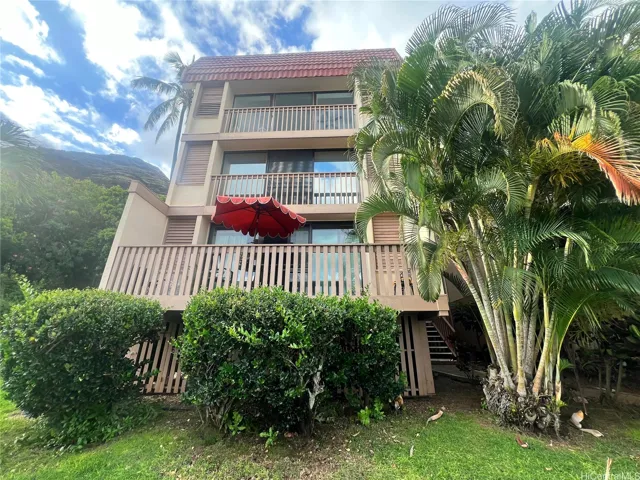 Front of building - Unit 82 A with Umbrella - Enhanced Photo