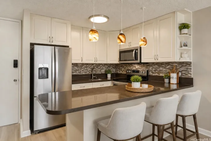 Kitchen and breakfast bar. Photo enhanced.