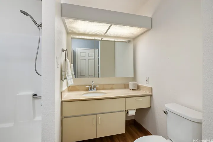 Spacious bathroom.  Low maintenance and easy to clean floors.  Floating cabinetry gives you the feeling of more space.